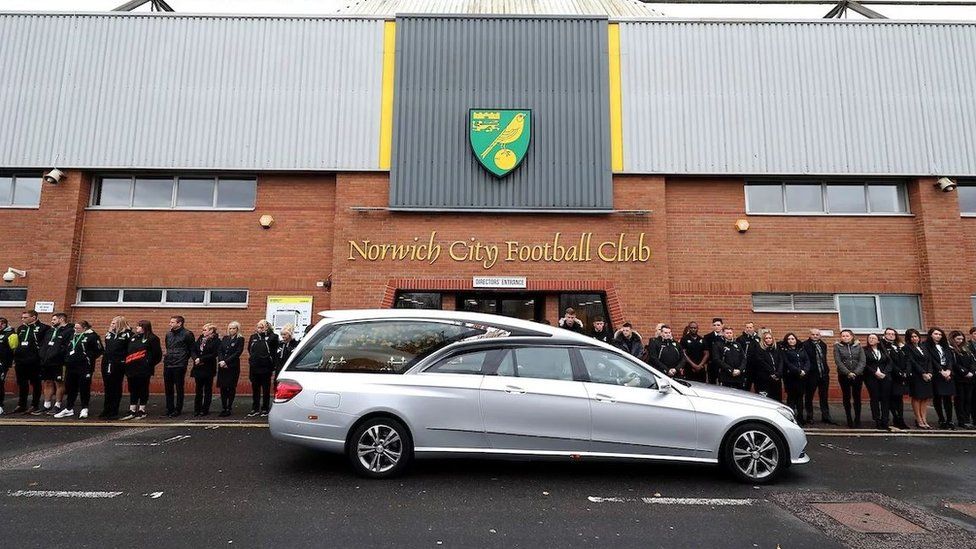 The funeral cortege was met outside Carrow Road by club staff and fans.