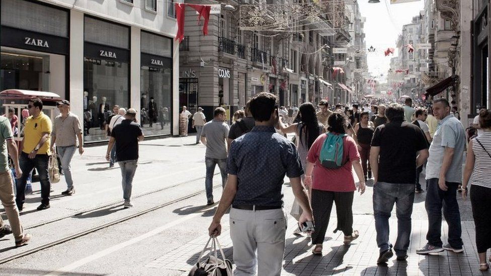 Local people and tourists walk on Istiklal Avenue in Beyoglu Istanbul