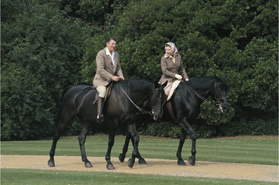 Queen Elizabeth II riding in the grounds of Windsor Castle with US President Ronald Reagan, during his state visit to the UK, 8 June 1982