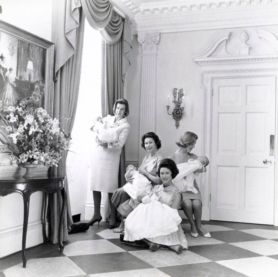 Queen Elizabeth II, Princess Margaret, Princess Alexandra and The Duchess of Kent holding their newborn babies