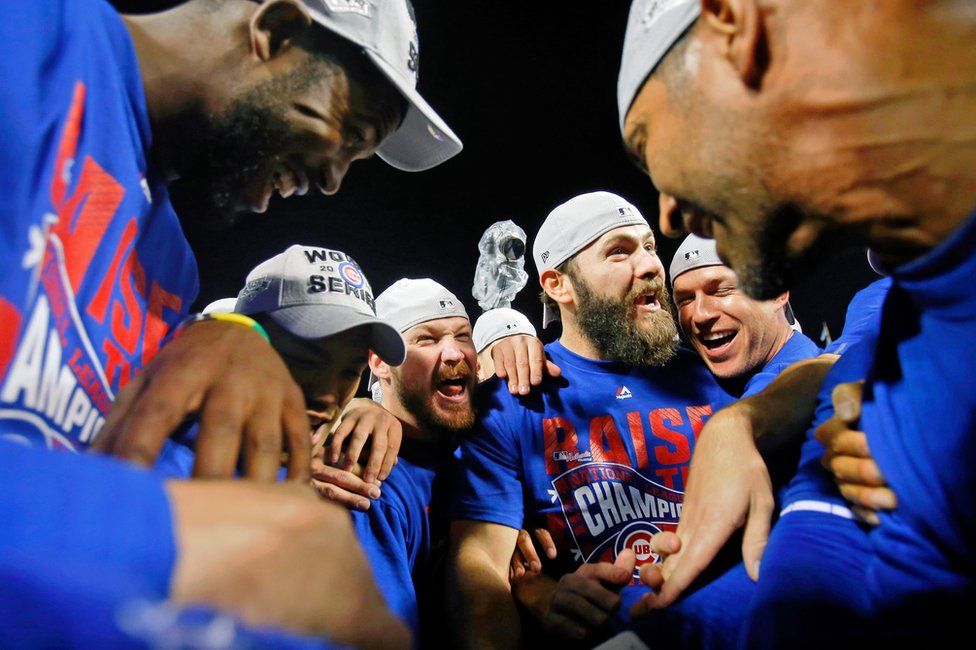 The Chicago Cubs celebrate in Chicago, 22 October