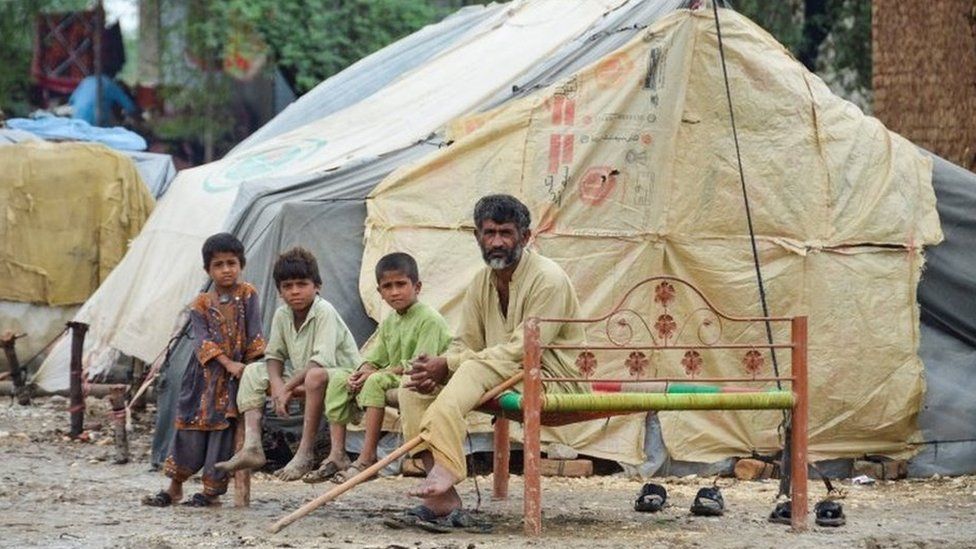 Large swathes of Pakistan have been affected - including these people in Jafarabad in Balochistan