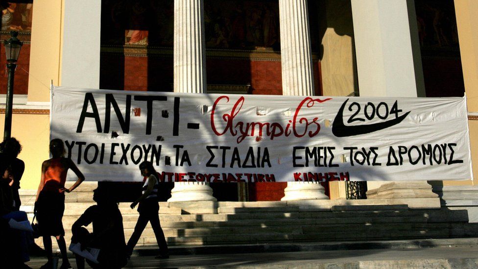 A banner which reads "They have the stadiums - We have the streets" is placed outside the entrance of Athens' university during an anti-Olympics demonstration.