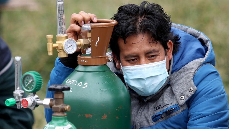 Man in Peru with mask and oxygen tank
