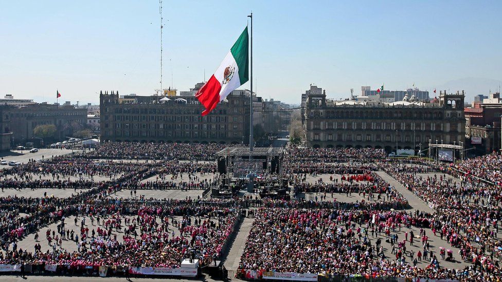 People wait for the arrival of Pope Francis to Mexico City"s main square, the Zocalo, Mexico, 13 February 2016