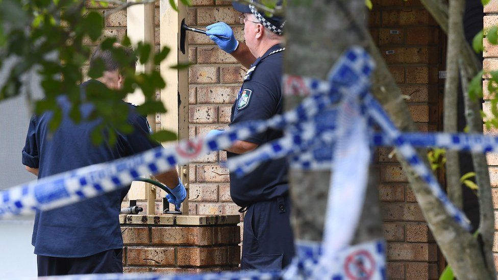 Police are seen at the scene of a fatal stabbing at a Whitfield Crescent in the suburb of North Lakes, near Brisbane