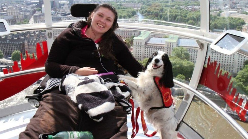 Lucy Watts on the London Eye with her support dog Molly