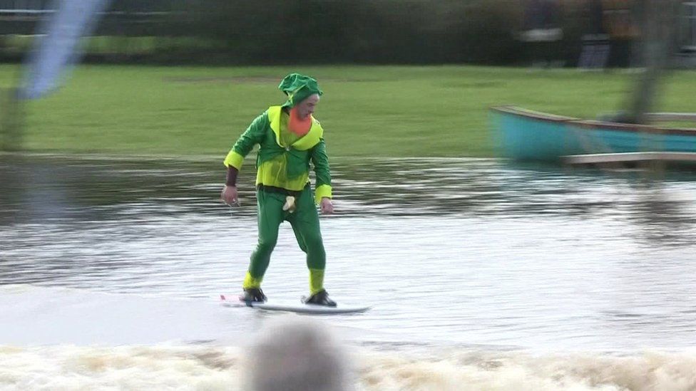 A man dressed as a leprechaun on a hydro foil on the River Erne