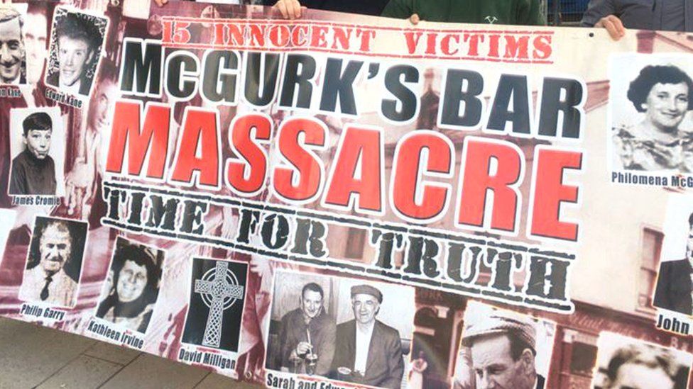 A banner depicting the victims of the McGurk's Bar bombing