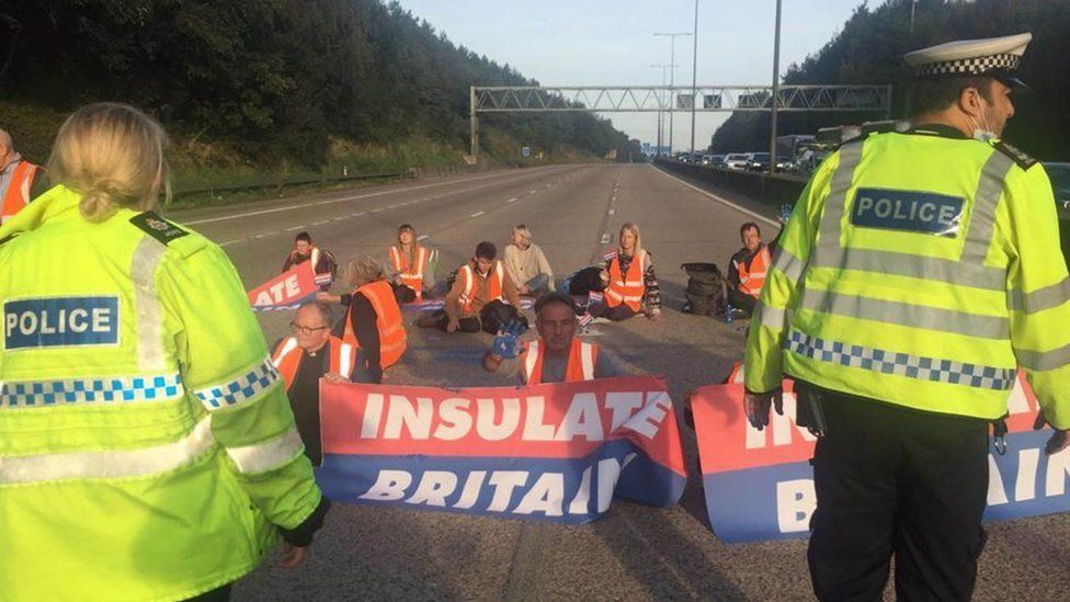 Insulate Britain protestors sitting in the road on the M25 in September