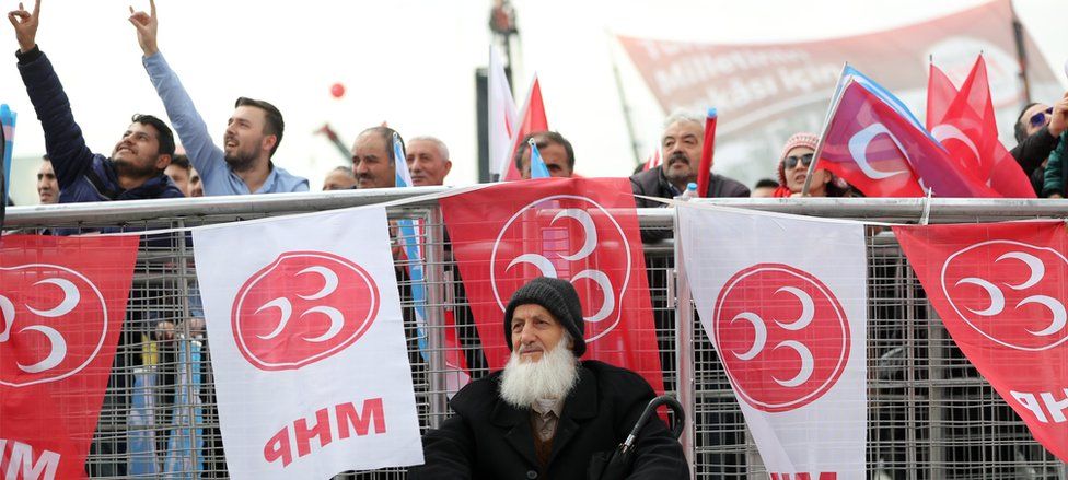 Supporters of Nationalist Movement Party (MHP) chanting and making a wolf sign (sign of the Turkish Nationalists) during a "Vote Yes" rally in Istanbul on 9 April