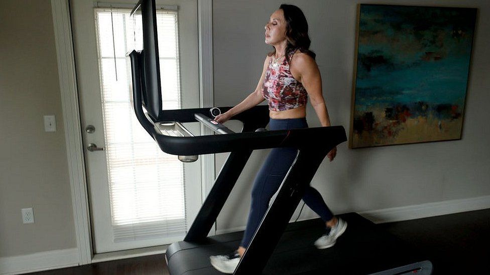 Woman on Peloton treadmill