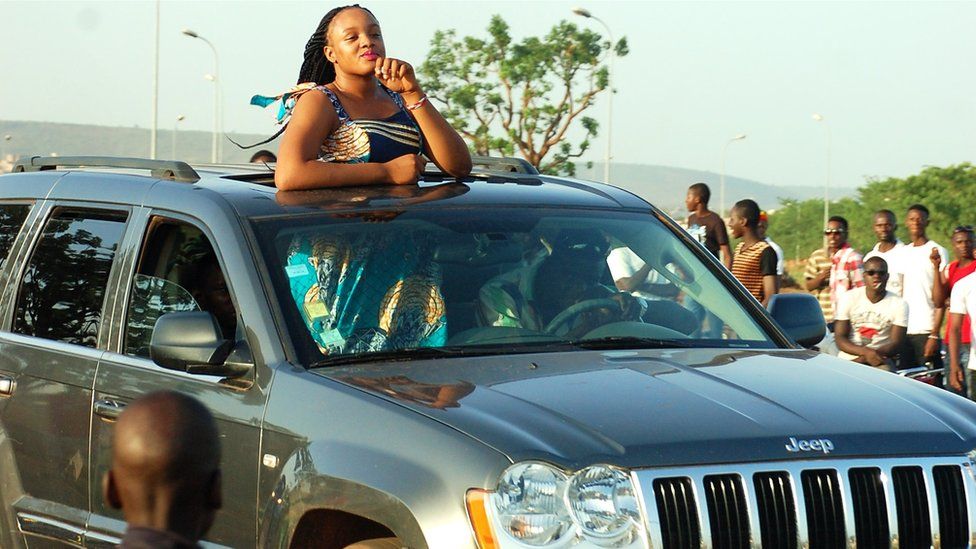 This Malian woman drives through the crowds in her luxurious SUV.