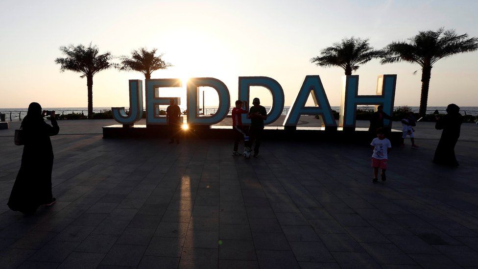 People stand on the corniche in Jeddah