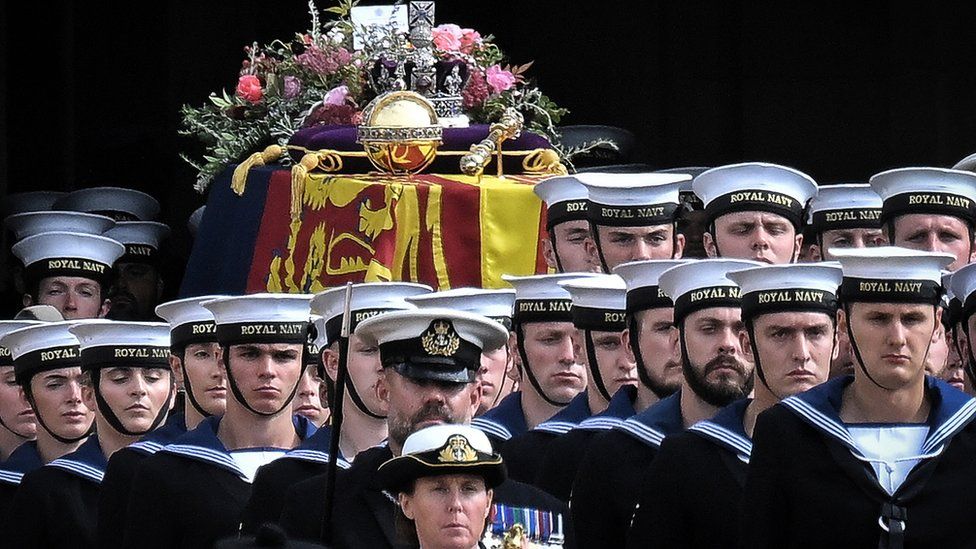 Close up of sailors and the Queen's coffin