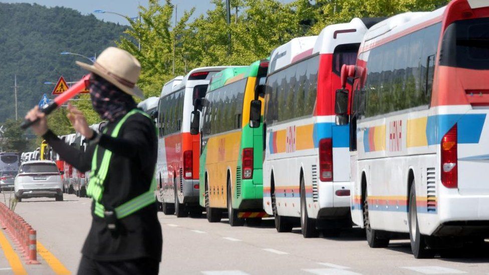 Buses are parked for participants leaving the camping site of the 25th World Scout Jamboree in Buan, South Korea, August 5, 2023.