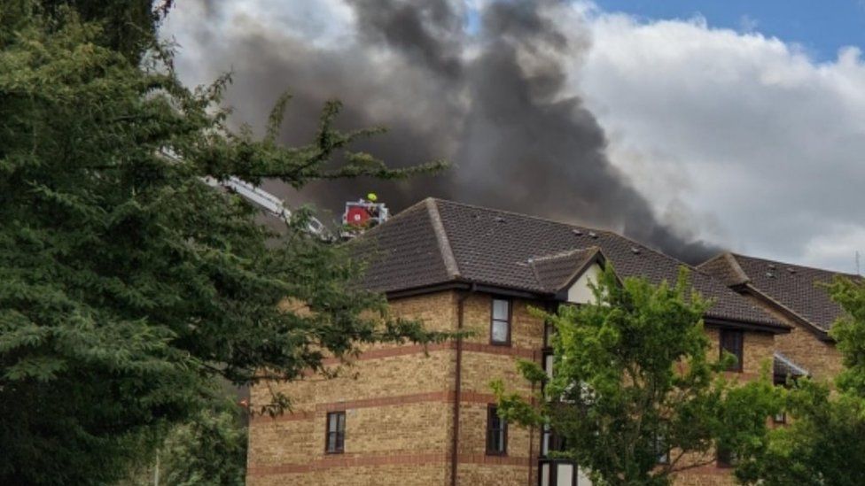 Firefighters tackling a blaze at Bedford flats