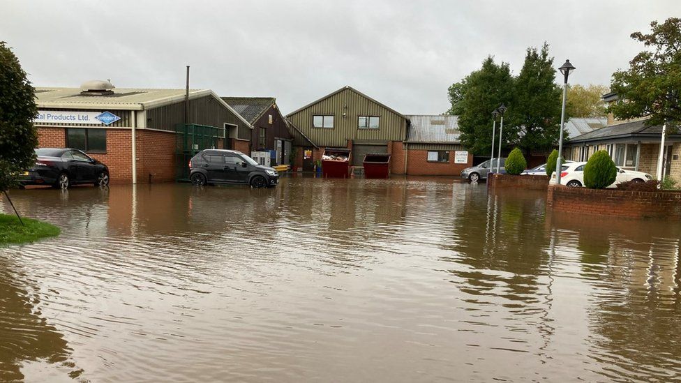 The car park of a dental factory in Purton flooded