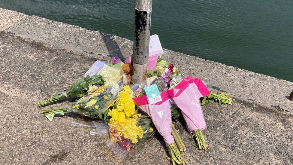 Floral tributes at Padstow harbour
