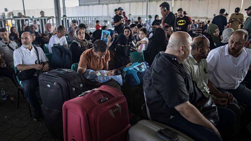 People waiting at the Rafah crossing