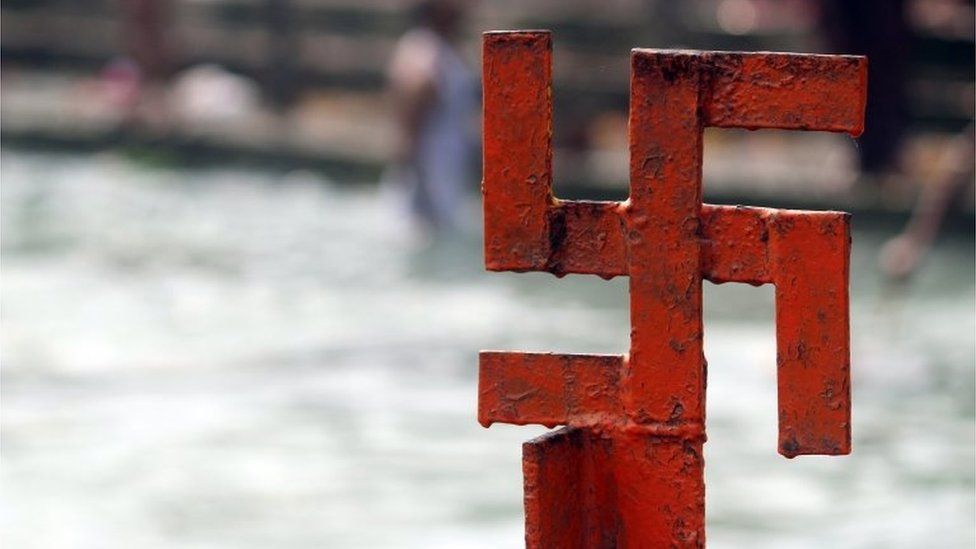 Red swastika cross on the Ganges River at Haridwar, Uttarakhand, India