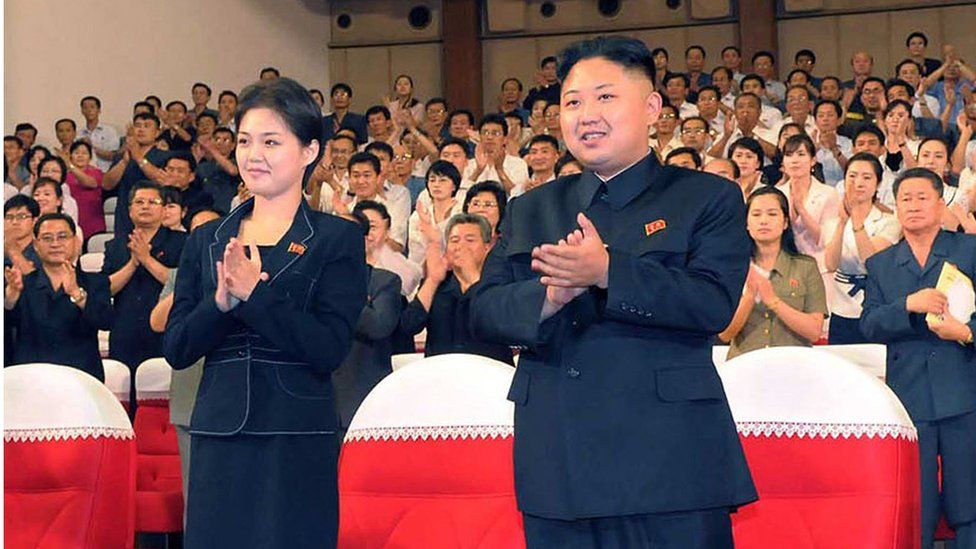 North Korea's leader Kim Jong-Un and his wife, applauding at a Moranbong Band concert