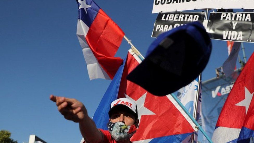 Chileans wave flag at a rally