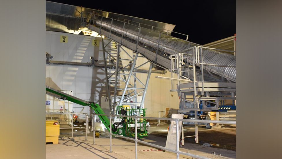 The construction site showing the full length of the conveyor belt and stairway