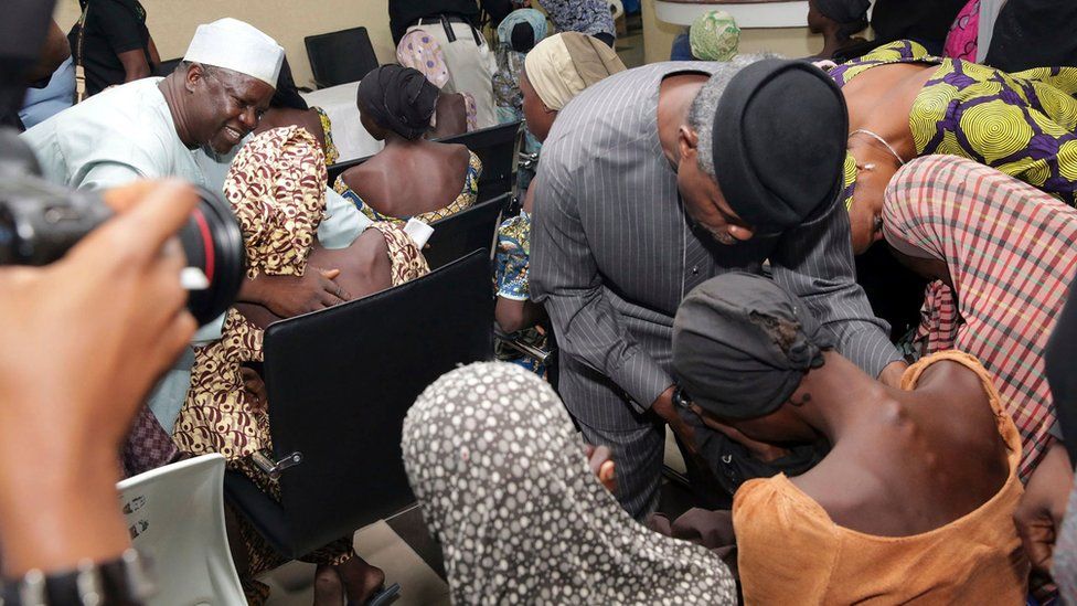 Nigeria's Vice President Yemi Osinbajo welcomes some of the freed Chibok schoolgirls in Abuja