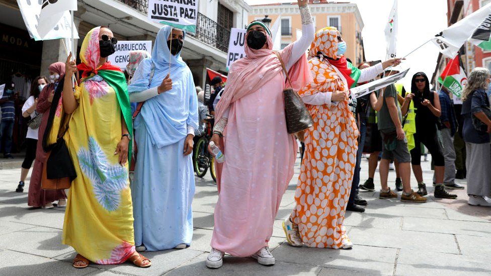 Four women taking part in a Saharawi freedom march in Madrid, Spain - Friday 18 June 2021