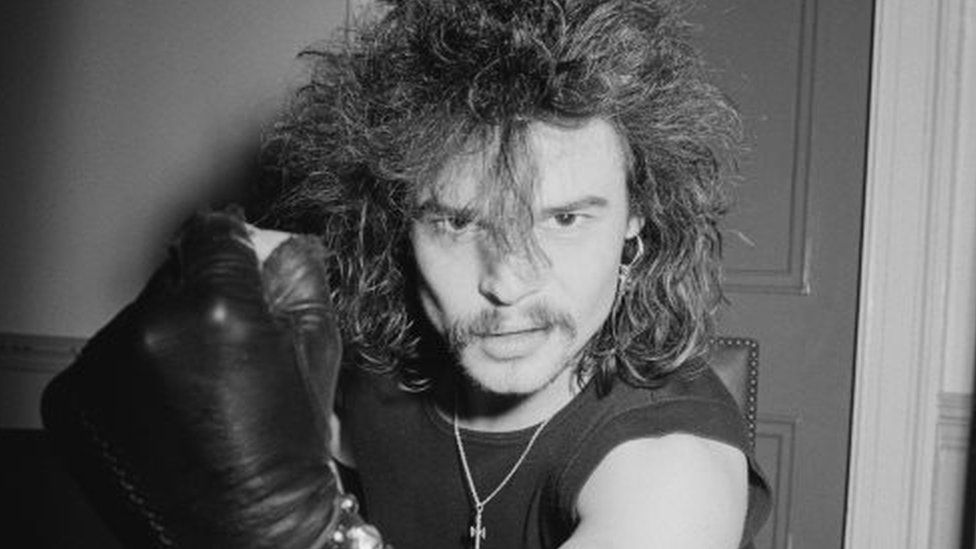Phil "Philthy Animal" Taylor from Motorhead clenches his fist backstage at City Hall in Newcastle, 1982