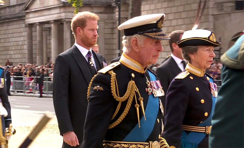 Prince Harry, King Charles III and Princess Anne follow the Queen's coffin after the funeral service in Westminster Abbey