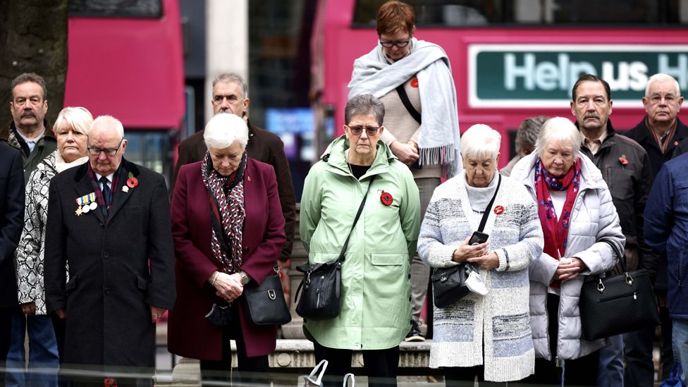 People observing Armistice Day in Belfast on 11 November 2021