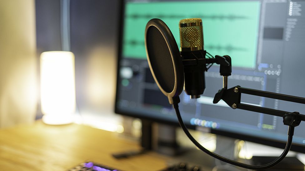 Microphone in front of audio editing studio