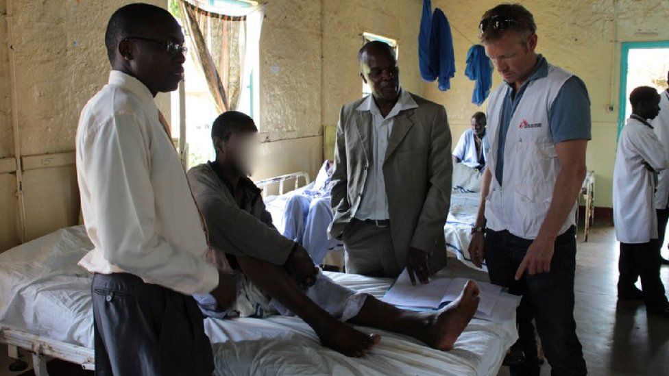 Dr Knut Eric Hovda with a methanol poisoning patient in Kenya