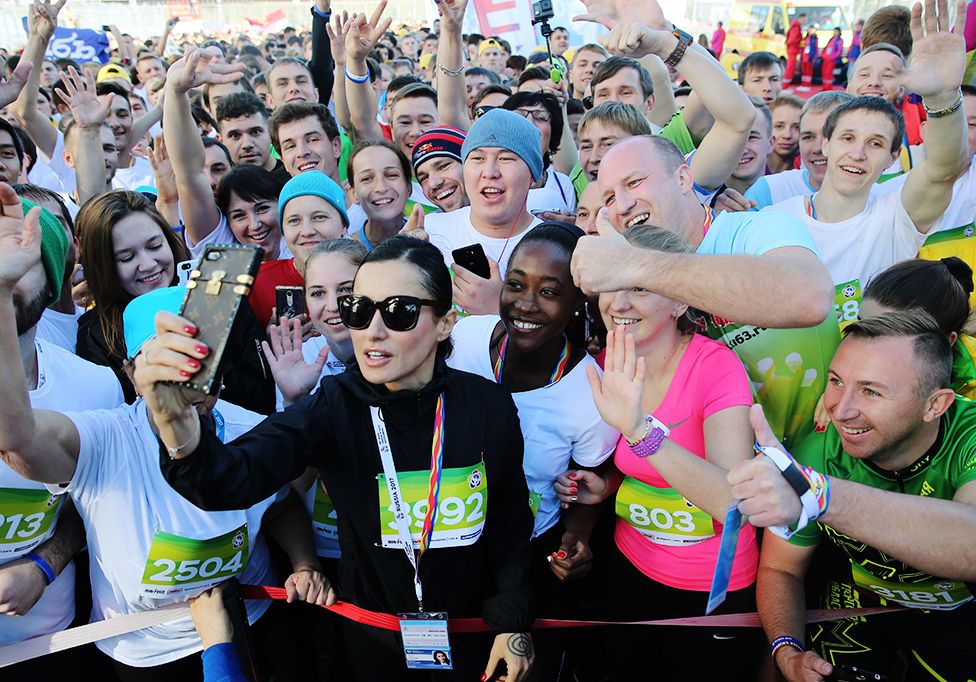 SEPTEMBER 16, 2017: Match TV General Producer Tina Kandelaki (C front) makes a selfie with participants in the Festival 2017-metre Race as part of the 2017 World Festival of Youth and Students at the Sochi Formula 1 track.