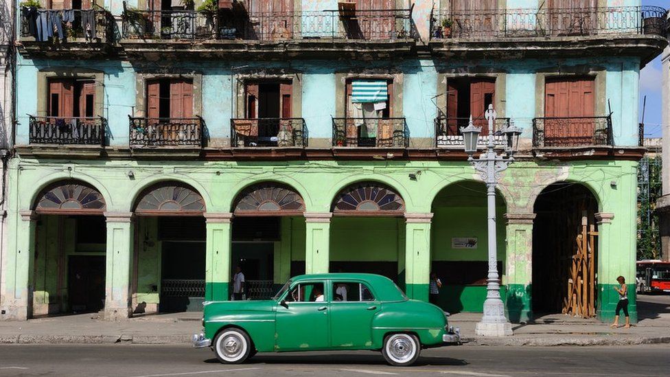 Brightly-painted buildings on Paseo de Marti opposite the National Capitol Building in Havana