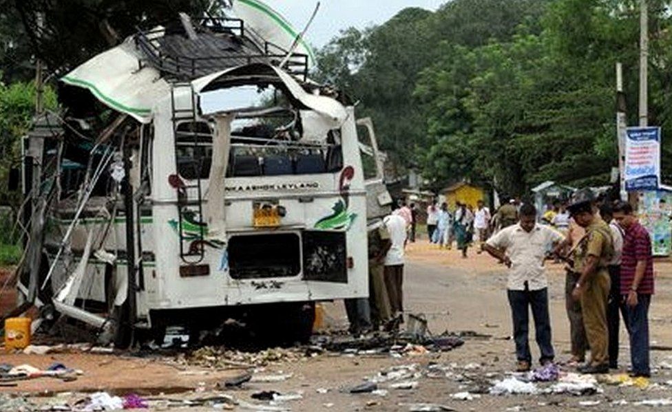 Sri Lankan officials investigate a suspected Tamil Tiger bombing of a civilian bus in Dambulla, 147 kilometres north of Colombo, on 2 February 2008.