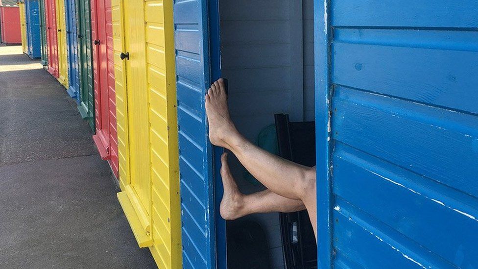 Legs in a beach hut