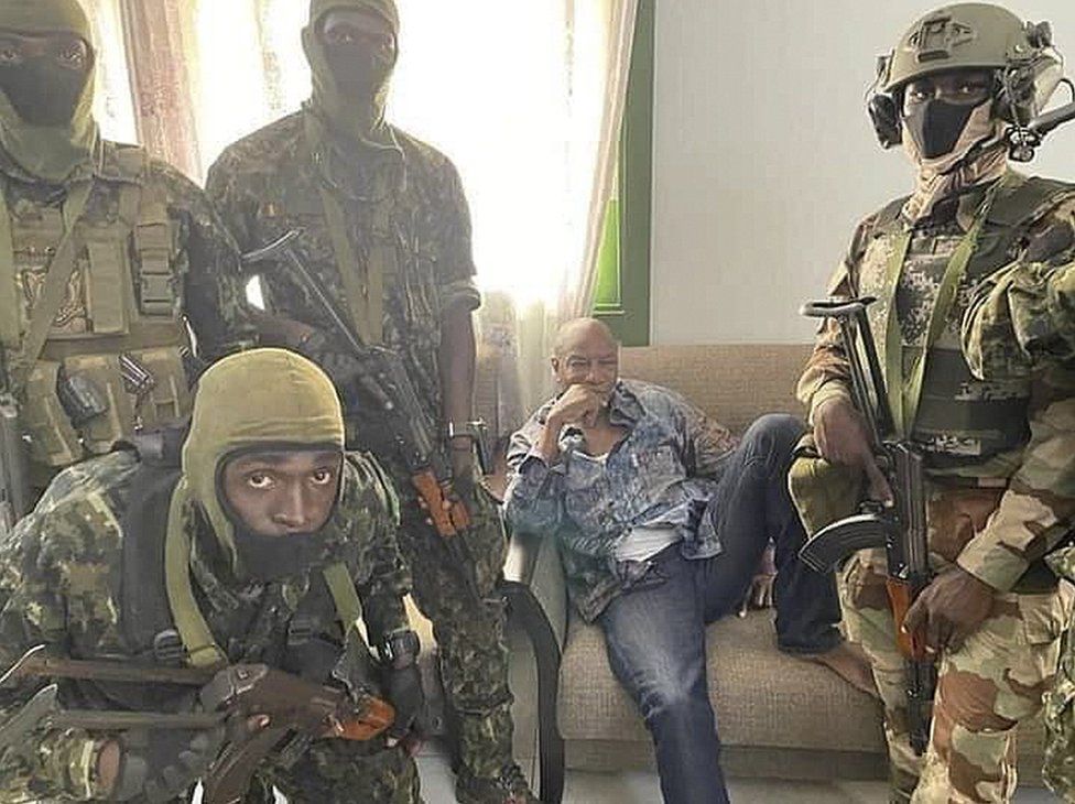 A handout photo made available by Guinea's military shows Alpha Condé, President of the Republic of Guinea (C) detained by army special forces in Conakry, Guinea, on 5 September.