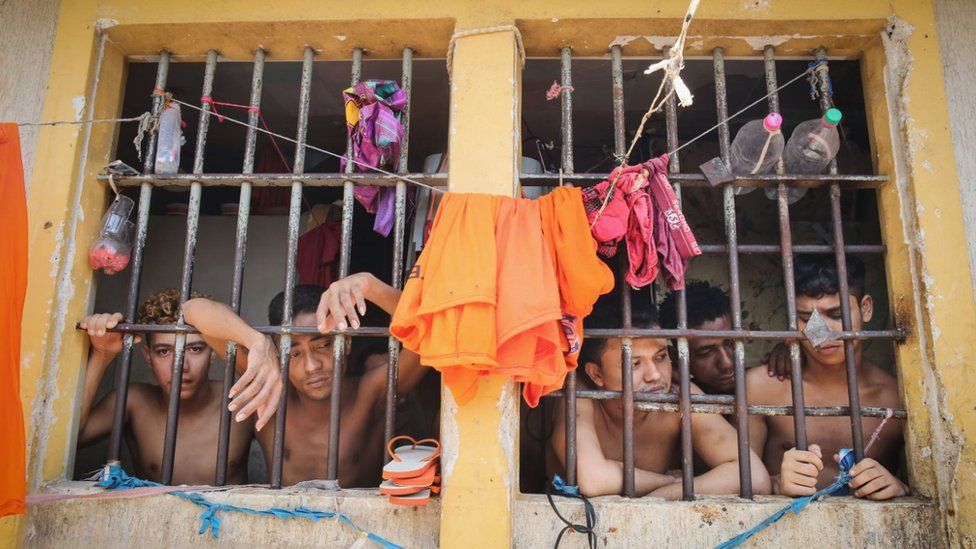Inmates stand in their cell in the Pedrinhas Prison Complex, the largest penitentiary in Maranhao state,