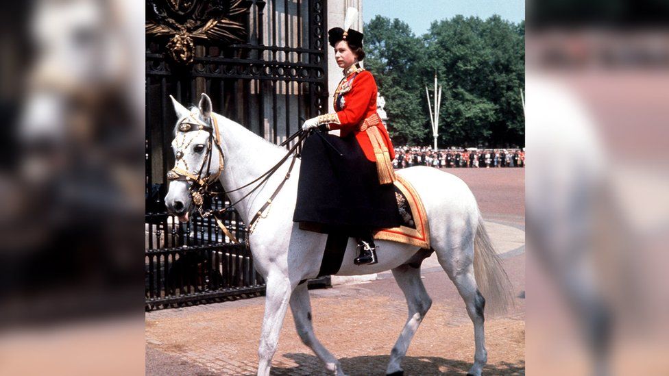 Queen riding side-saddle at the ceremony in 1963