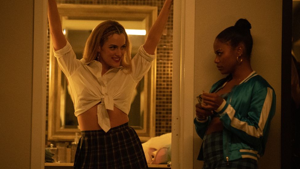 Riley Keough (left) stars as Stefani and Taylour Paige (right) stars as Zola