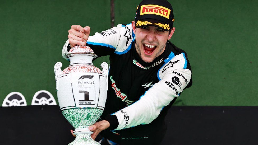Esteban Ocon holds his winners trophy at the Hungarian Grand Prix