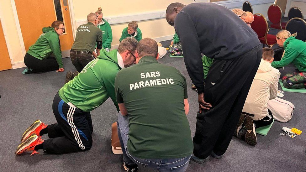 Members of Kesgrave Kruisers practising CPR on dummies