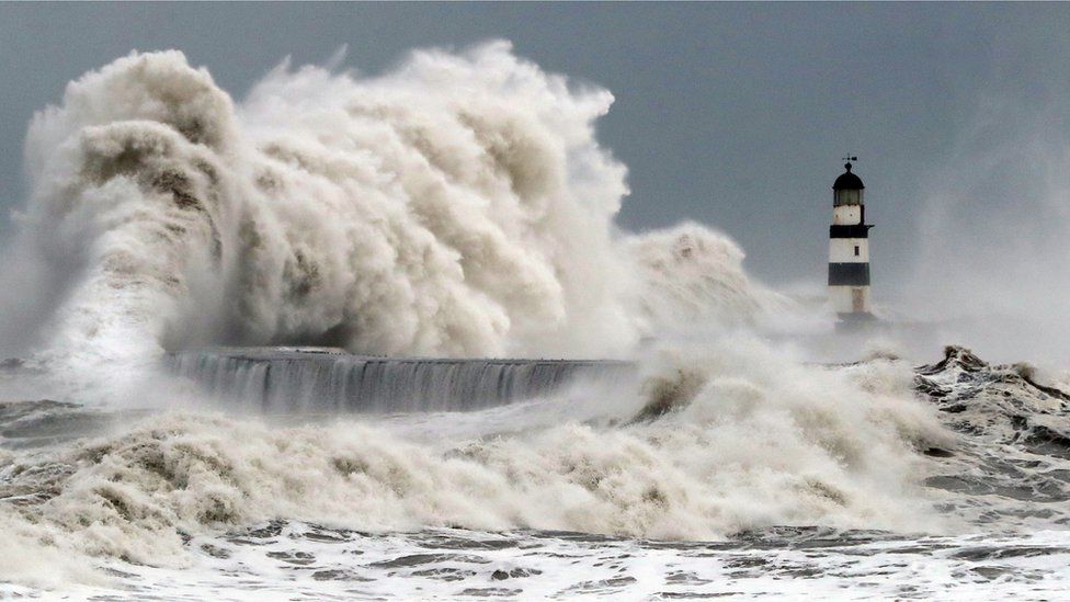 Waves crash into the sea wall at Seaham Harbour