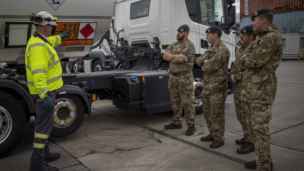 Military personnel conduct tanker training