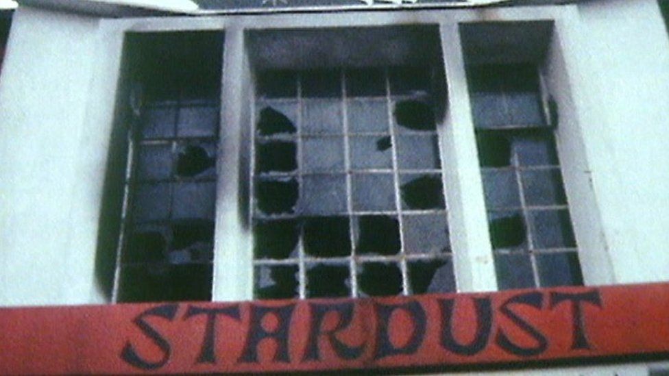 A picture of the burnt out windows of the Stardust nightclub