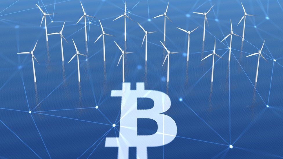 Bitcoin sign with wind turbines