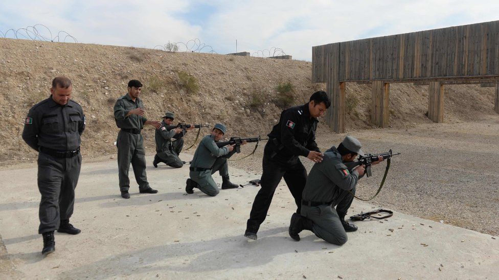 In this photo taken on November 21, 2018, newly-recruited Afghan policemen display their skills at a police training centre in Mazar-i-Sharif.